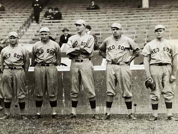 Members of the Red Sox, including Babe Ruth (second from right), stand together.